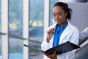 African-American medical professional with a chart